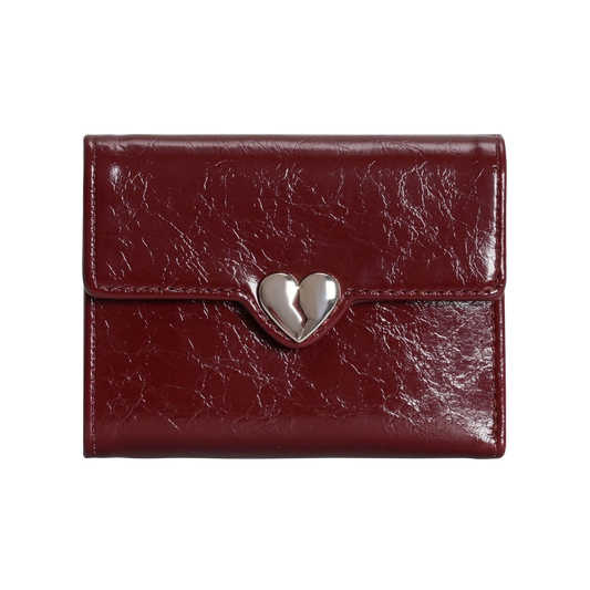 Red leather wallet with a silver heart-shaped clasp