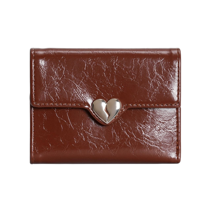 Brown leather wallet with a silver heart-shaped clasp