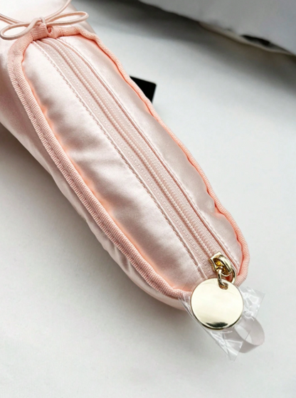 Pink satin pouch with a gold clasp