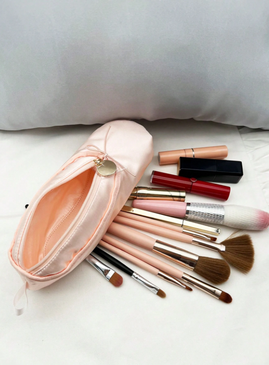 Pink satin pouch with a gold clasp