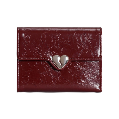 Red leather wallet with a silver heart-shaped clasp