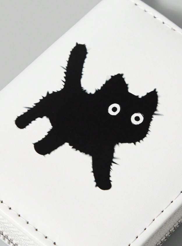 White wallet with black cat design and keychain