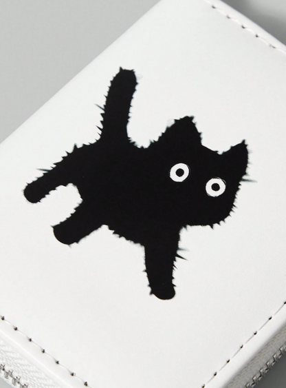 White wallet with black cat design and keychain